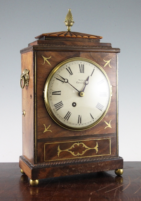 A Regency brass inset mahogany mantel timepiece, with circular Roman dial and architectural case,