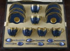 A Royal Worcester powder blue coffee set for six, c.1924, each cup decorated with a rim border of