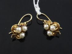A pair of gold, black enamel and triple cultured pearl set cluster earrings, 1in.