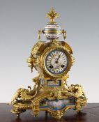 A 19th century French ormolu and Sevres style porcelain mantel clock, the painted signed by Henry