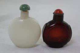 Two Chinese coloured glass snuff bottles, 18th / 19th century, the first of watch form simulating