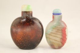 Two Chinese glass simulated stone snuff bottles, 1760-1880, the first of spade form in imitation of