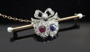 An Edwardian gold and silver, ruby, sapphire, seed pearl and old cut diamond set twin hearts
