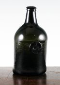 An English glass sealed squat cylindrical wine bottle, c.1780, bearing the seal for `J.Astley`, 8.