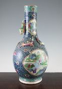 A Chinese famille rose bottle vase, late 19th century, painted in vivid enamel colours with