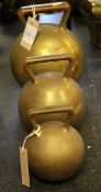 A set of three brass spherical weights, 56lb to 14lb, each marked The Borough of Worthing