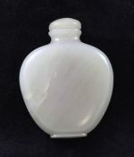 A Chinese celadon jade snuff bottle, 1800-1900, of spade form, on an oblong foot, 6.2cm.