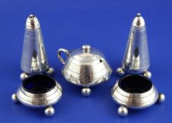 A Victorian five piece silver condiment set, of stylised compressed circular form with ball feet,