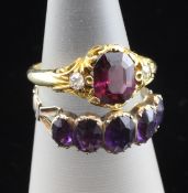 A Victorian garnet and diamond set three stone ring, size G, and an early Victorian amethyst set