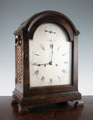 A George III mahogany bracket clock, with arched case and silvered dial with subsidiary seconds and