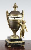 A late 19th century French ormolu urn shaped timepiece, with cupid pointer, on green marble plinth,