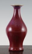 A Chinese flambe baluster vase, 18th / 19th century, with flared neck and ground foot, 22cm.