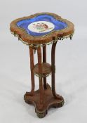 A 19th century French ormolu mounted kingwood jardiniere stand, the top inset with a Sevres style