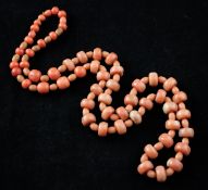 A single strand coral bead necklace, with mainly disc and oval shaped beads, gross weight 58 grams,