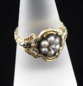 A William IV 18ct gold, diamond, seed pearl and black enamel mourning ring, with ornate pierced