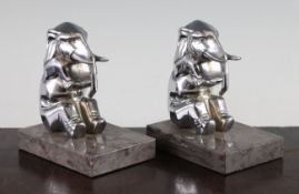 A pair of French Art Deco chromed metal bookends modelled as seated elephants, 5in.