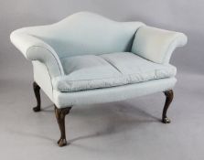 A small George I style settee, with hump back and scrolling arms, on walnut cabriole legs and