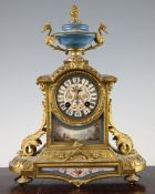 A 19th century French ormolu and Sevres style porcelain mantel clock, with urn surmount and panel