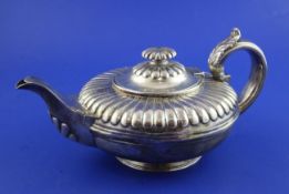 A George IV silver teapot, of squat circular form, with fluted collar and banded girdle, Charles