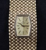 A lady`s 1970`s 9ct gold Marvin manual wind bracelet wristwatch, with hexagonal dial and baton