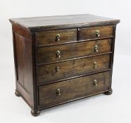 An 18th century oak chest, of two short and three long graduated drawers, on bun feet, W.3ft 4in.
