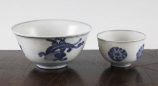 Two Chinese Ming blue and white bowls, the first a teabowl painted to the exterior with flower