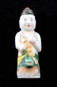 A Chinese enamelled porcelain figural snuff bottle, 19th century, modelled in the form Liu Hai and