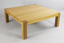 A modern light oak coffee table, with square section supports, W.3ft 7.5in.