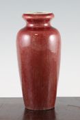 A Chinese sang-de-boeuf glazed vase, 19th century, of ovoid form with a garlic neck, 18.8cm.