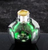 A Chinese facetted green glass snuff bottle, 19th century, of hexagonal form with pentagonal and