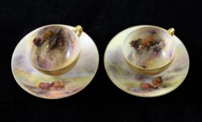 Two Royal Worcester Highland cattle painted cabinet coffee cups and saucers, by Harry Stinton, both
