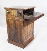 An unusual Regency rosewood Davenport, of squared columnar form decorated with paterae roundels and