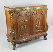 A 20th century continental walnut and parcel gilt side cabinet, with two doors opening to reveal