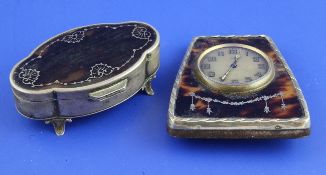 A George V silver and tortoiseshell eight day bedside timepiece, Sheffield, 1925, 4in. and a