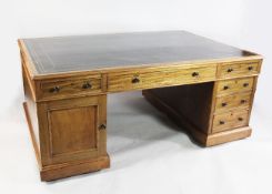A large Victorian mahogany partner`s pedestal desk, with gilt tooled leather skiver, three frieze