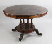 A 19th century mahogany inlaid breakfast table, the polygon shaped top with central star motif and