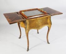 A Louis XV style ormolu mounted kingwood and tulipwood `surprise` table, retailed by Maple & Co,