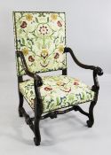 A Louis XV style stained beech open armchair, with acanthus carved scrolling arms and legs, with