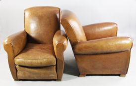 A pair of 1930`s French tan leather club armchairs, with darker piping