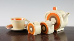 A Clarice Cliff eight piece Bizarre breakfast set, decorated with concentric circles, the cups only