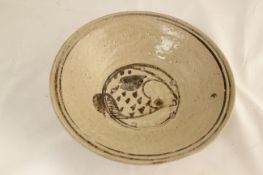 Two Thai Sukhothai dishes, 14th century, the first with two circular concentric bands, the centre