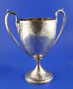 A George III Scottish silver two handled pedestal trophy cup, engraved with the crest and motto of