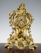 A 19th century French ormolu mantel clock, the asymmetrical scroll case decorated with Venus, a