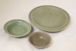 Three Chinese Longquan celadon dishes, Song dynasty, the first an offering dish moulded to the