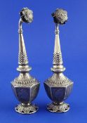 A pair of Middle Eastern white metal rose water sprinklers, of hexagonal form, with flowerhead