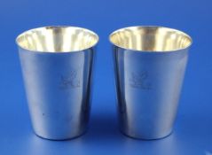 A pair of George III silver beakers, of tapering cylindrical form, with engraved armorial, Walter