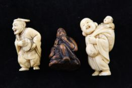 Three Japanese netsuke, 19th / early 20th century, two in ivory, the first carved as a standing