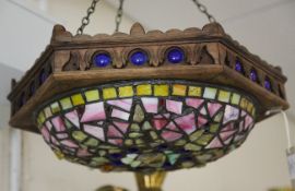 A marbled glass and coloured stone ceiling shade, with octagonal oak frame with stiff leaf carved