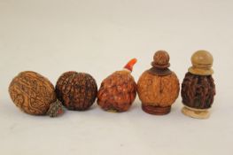 Five Chinese nut snuff bottles, 20th century, four formed from carved walnuts, the first with the