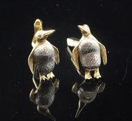 A pair of 18ct two colour gold novelty cufflinks modelled as penguins, with textured body and